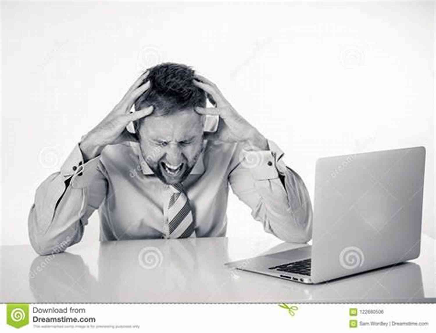 Stressed Entrepreneur Holding Head In Hands While Working On Laptop Burn Rate: Launching A Startup And Losing My Mind