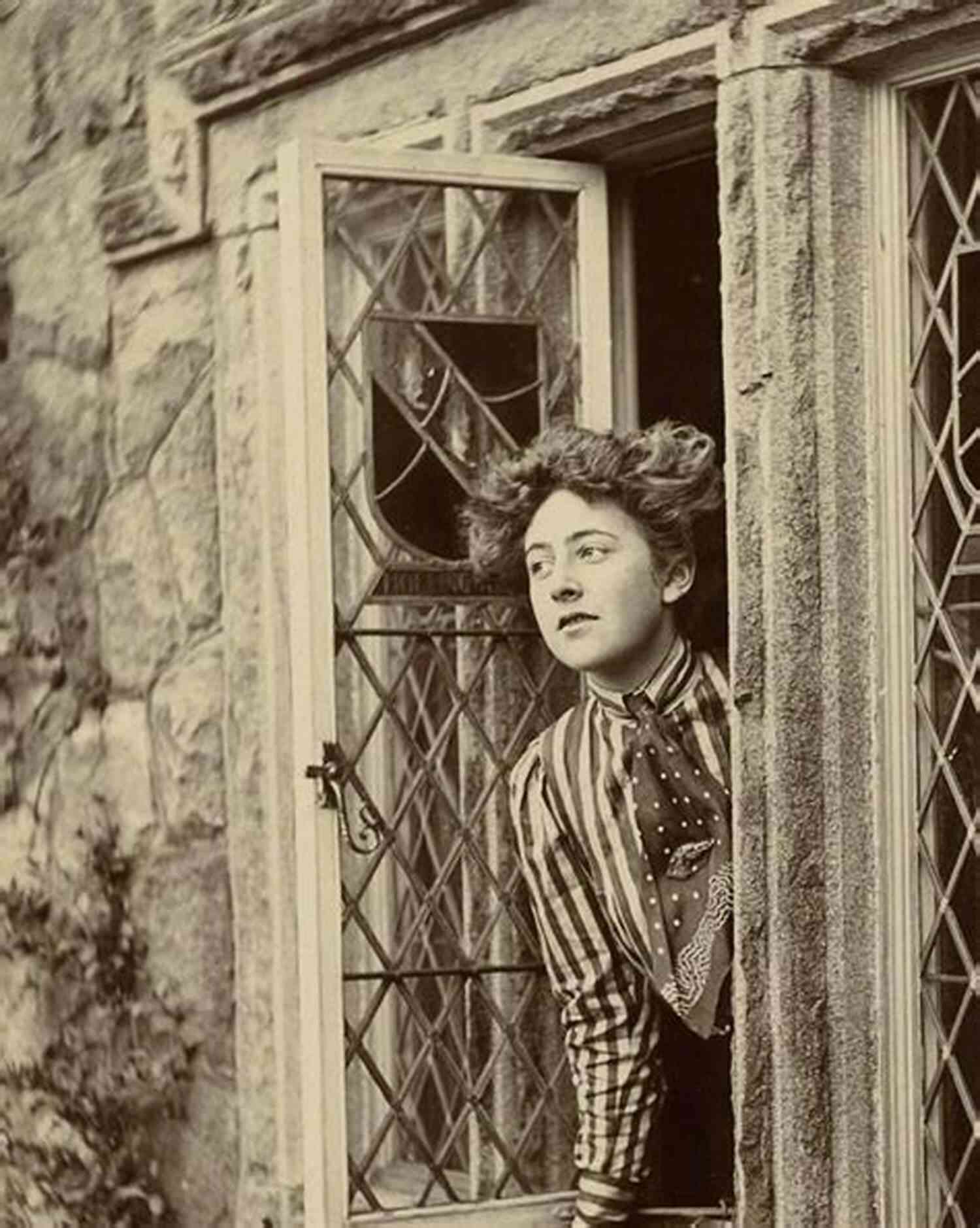 Young Agatha Christie Holding A Book, Her Piercing Gaze Hinting At The Intrigue That Would Fill Her Future Novels. An Autobiography Agatha Christie